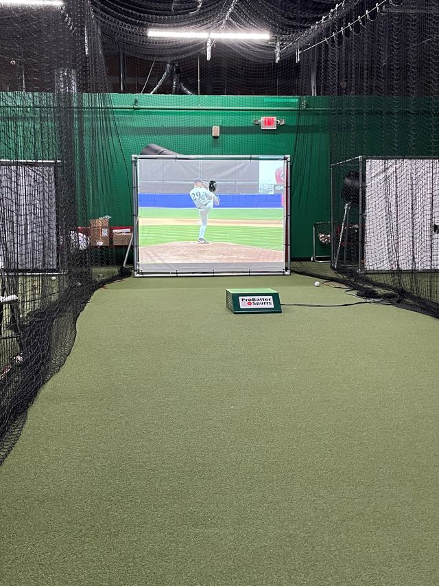 ProBatter Professional PX3 video-based baseball pitching simulator used for youth travel team batting practice