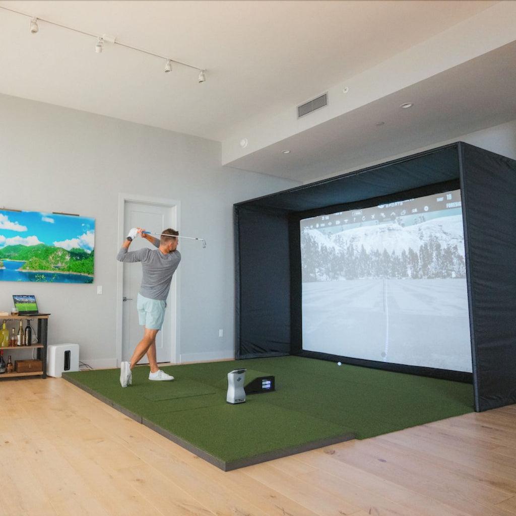 SIG12 Golf Simulator Enclosure with golfer practicing