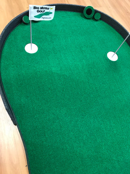 Big Moss Augusta V2 putting green with stadium backstop and flagstick.
