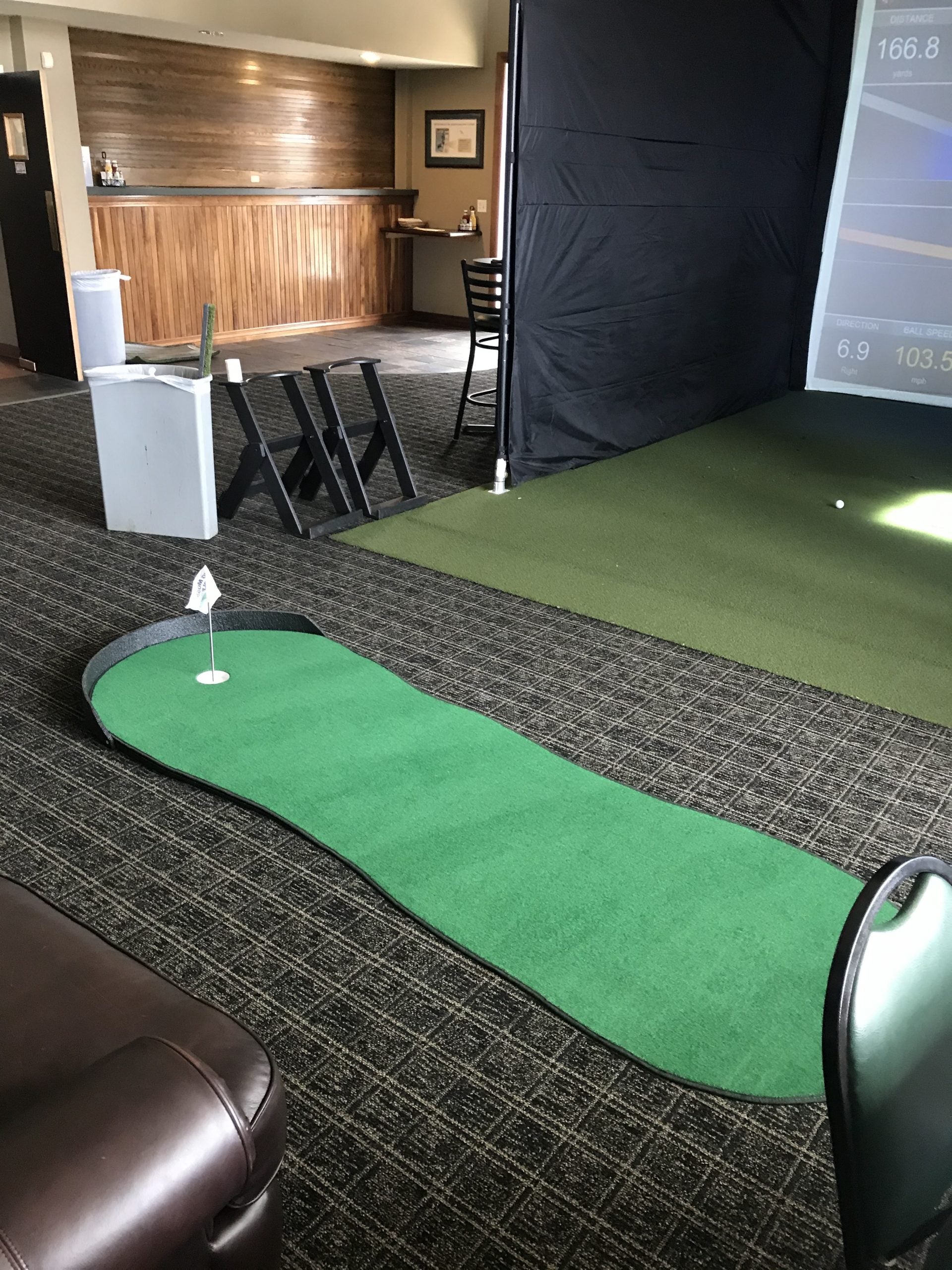 Big Moss Original V2 indoor putting green set up with flagstick and regulation cup.